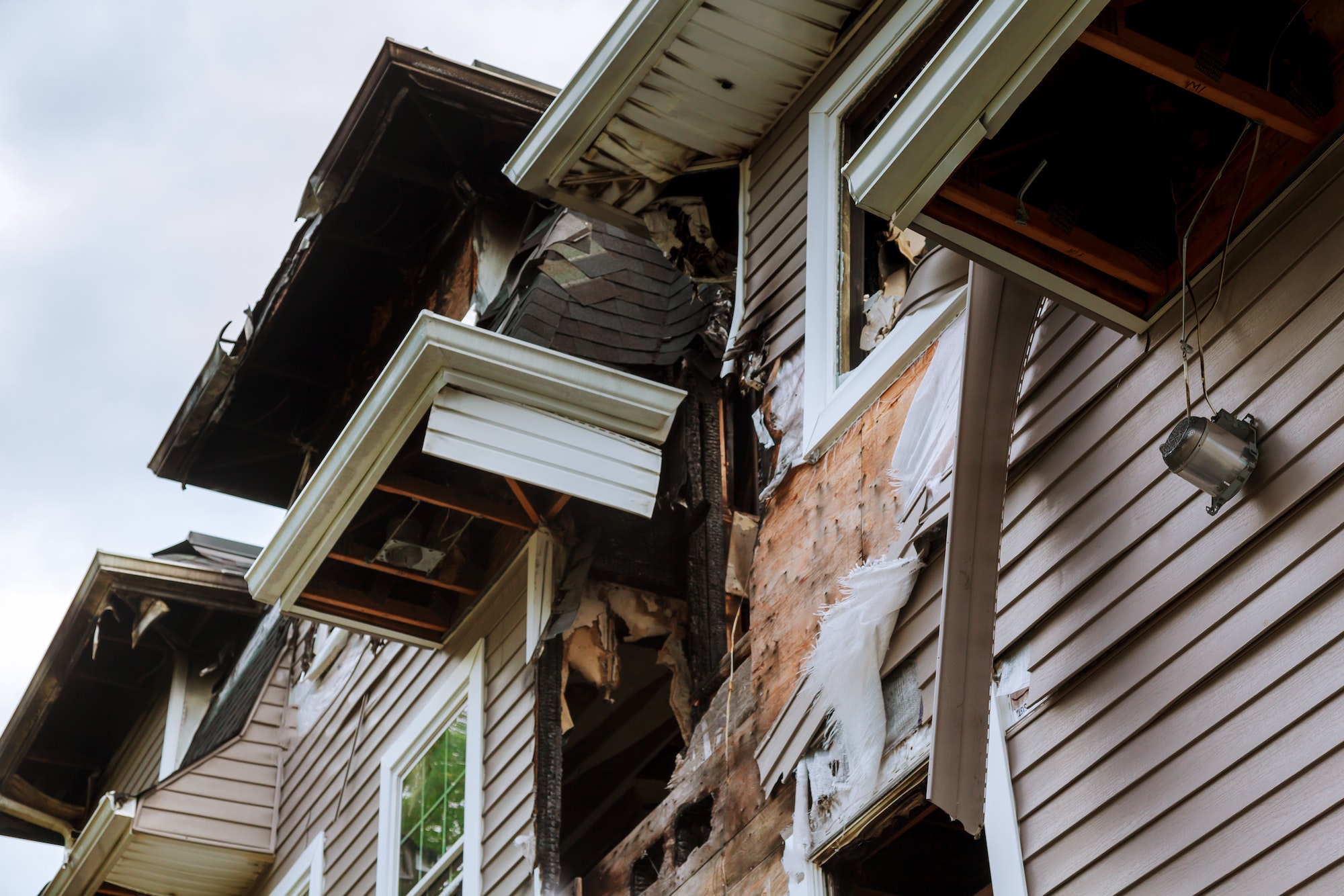 The house after a fire burned house Ruined abandoned burnt-out wooden house